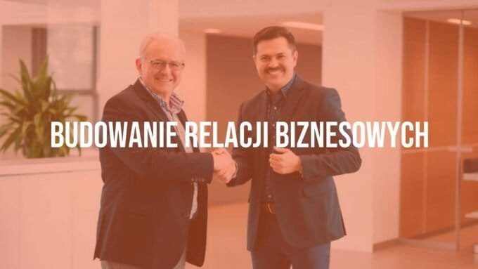 A professional business handshake between two people in a modern office setting, symbolizing trust and partnership, with a warm and positive atmosphere.